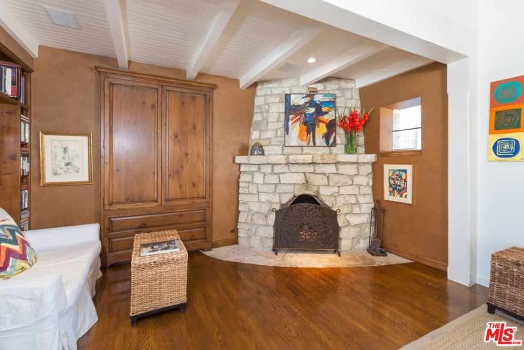 1766 Westridge Road Los Angeles, CA 90049 - Photo 11 of 54 a living room with furniture and a fireplace