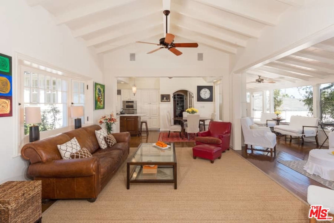 1766 Westridge Road Los Angeles, CA 90049 - Photo 12 of 54 a living room with furniture or couch and a chandelier