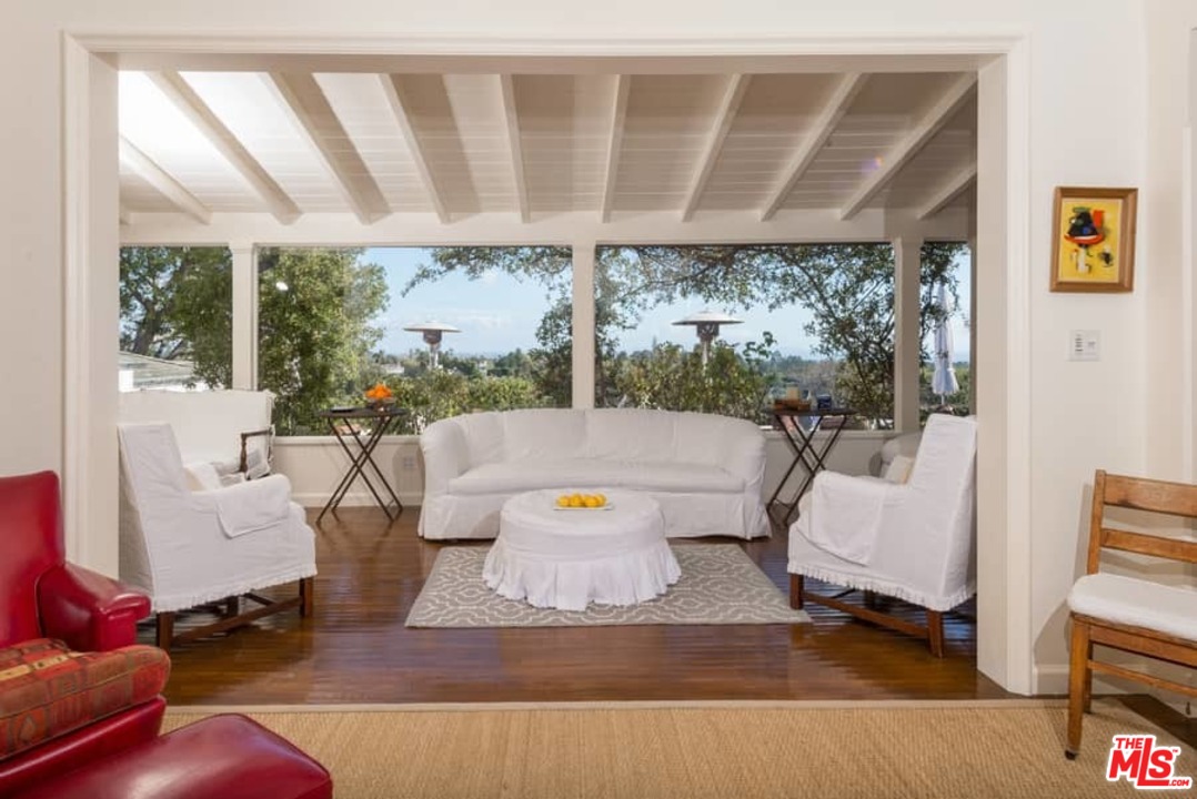 1766 Westridge Road Los Angeles, CA 90049 - Photo 13 of 54 a living room with furniture and a large window