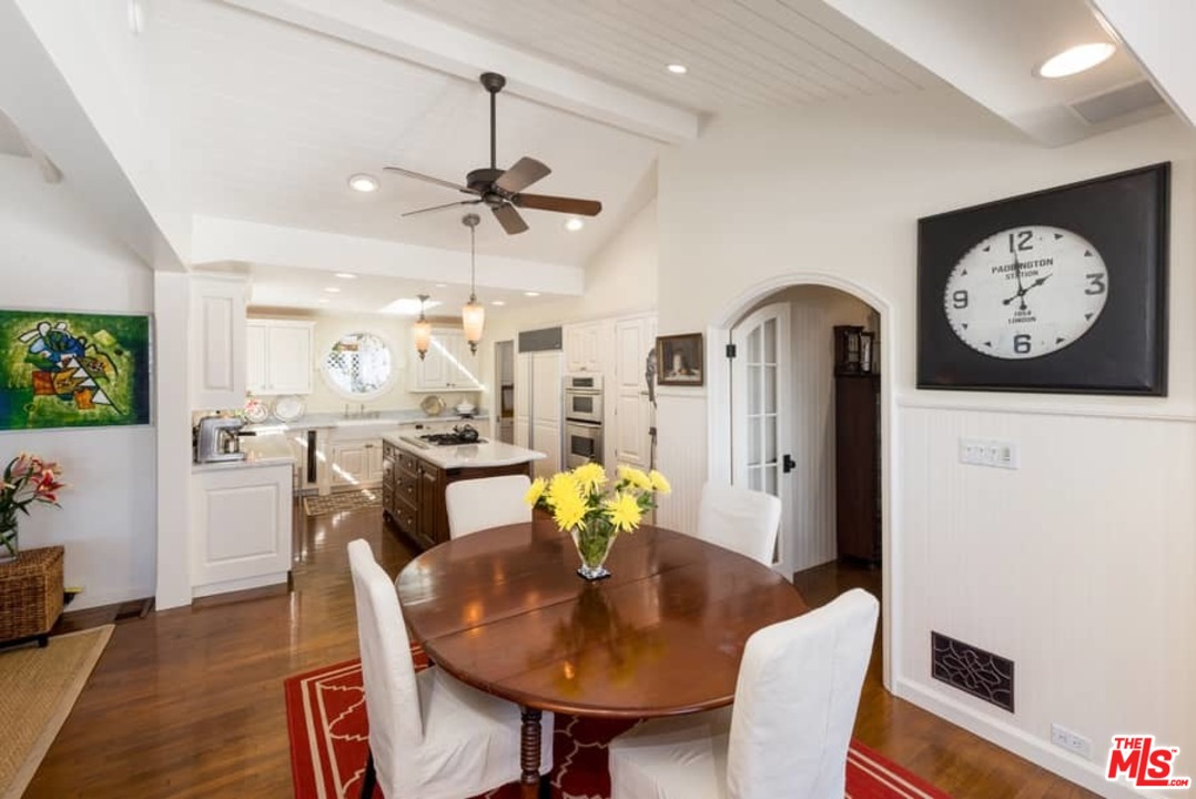 1766 Westridge Road Los Angeles, CA 90049 - Photo 18 of 54 a view of a dining room with furniture and a chandelier
