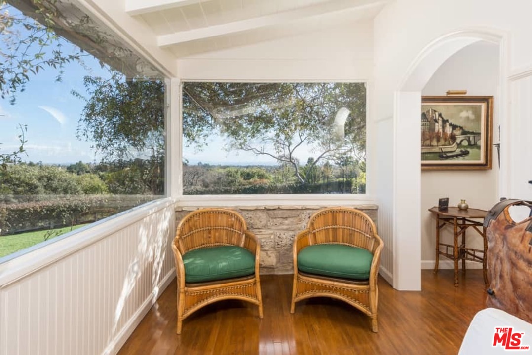 1766 Westridge Road Los Angeles, CA 90049 - Photo 32 of 54 a balcony with furniture and wooden floor