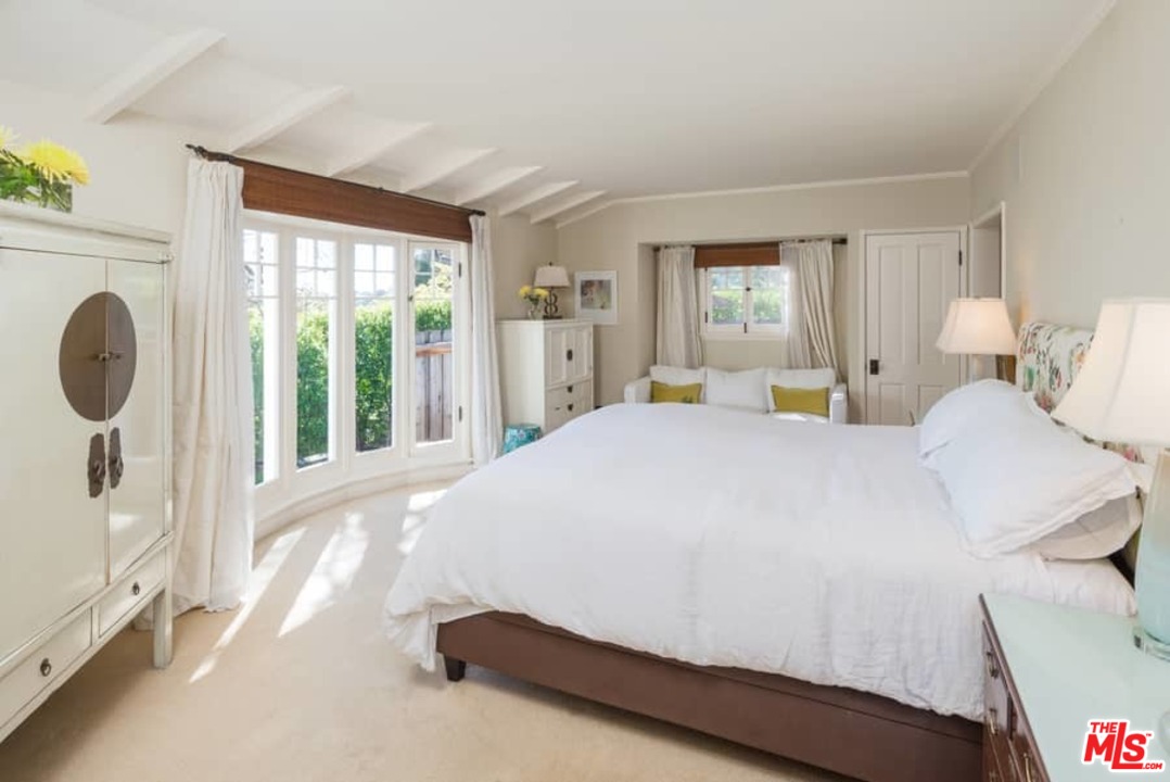 1766 Westridge Road Los Angeles, CA 90049 - Photo 39 of 54 a bedroom with a bed and a large window