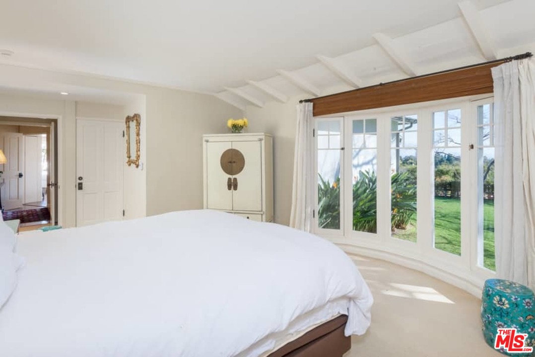 1766 Westridge Road Los Angeles, CA 90049 - Photo 40 of 54 a bedroom with a bed and a large window