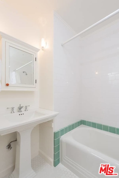 1766 Westridge Road Los Angeles, CA 90049 - Photo 44 of 54 a bathroom with a sink and a bathtub