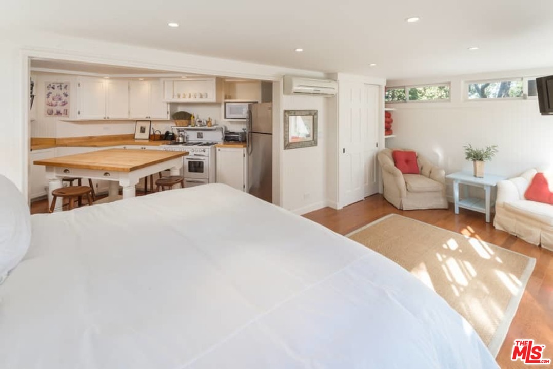 1766 Westridge Road Los Angeles, CA 90049 - Photo 52 of 54 a bedroom with a bed and a couch
