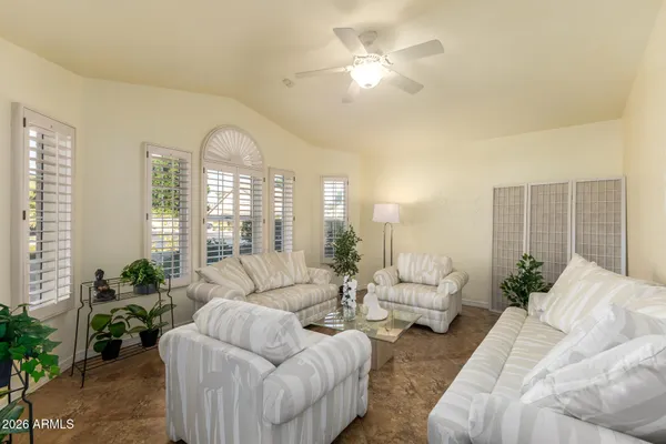 a living room with furniture and a large window