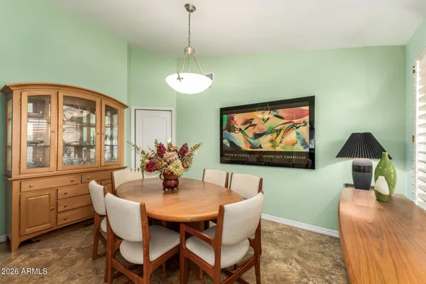 a view of a dining room with furniture window and outside view
