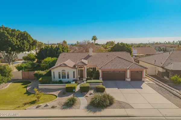 an aerial view of a house with a ocean view