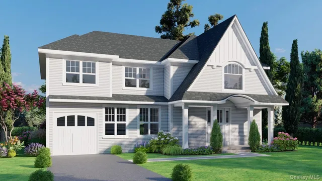 a view of a white house with a yard and plants