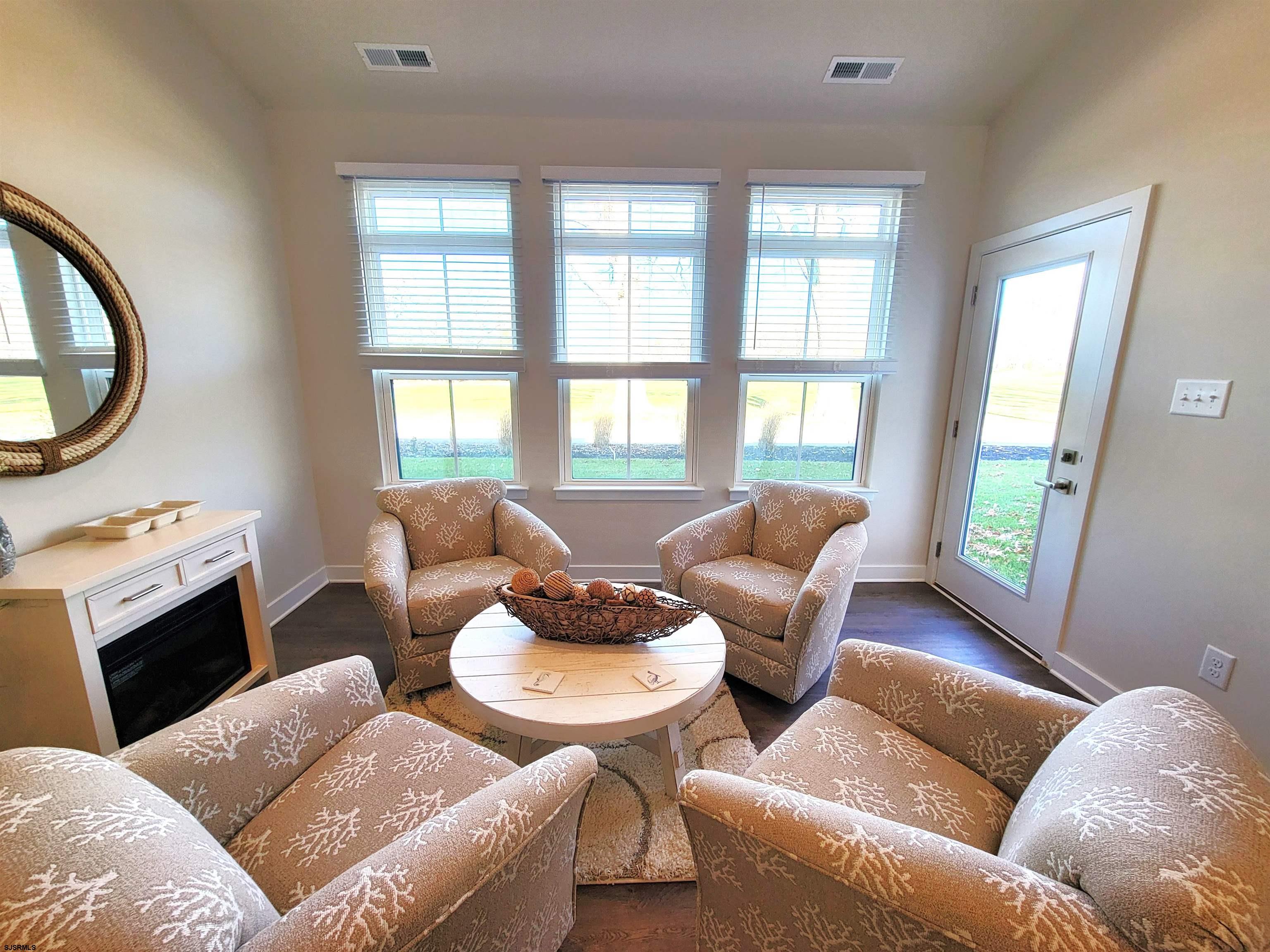 1004 Jesse Drive Somers Point, NJ 08244 - Photo 15 of 45 a living room with furniture and a fireplace