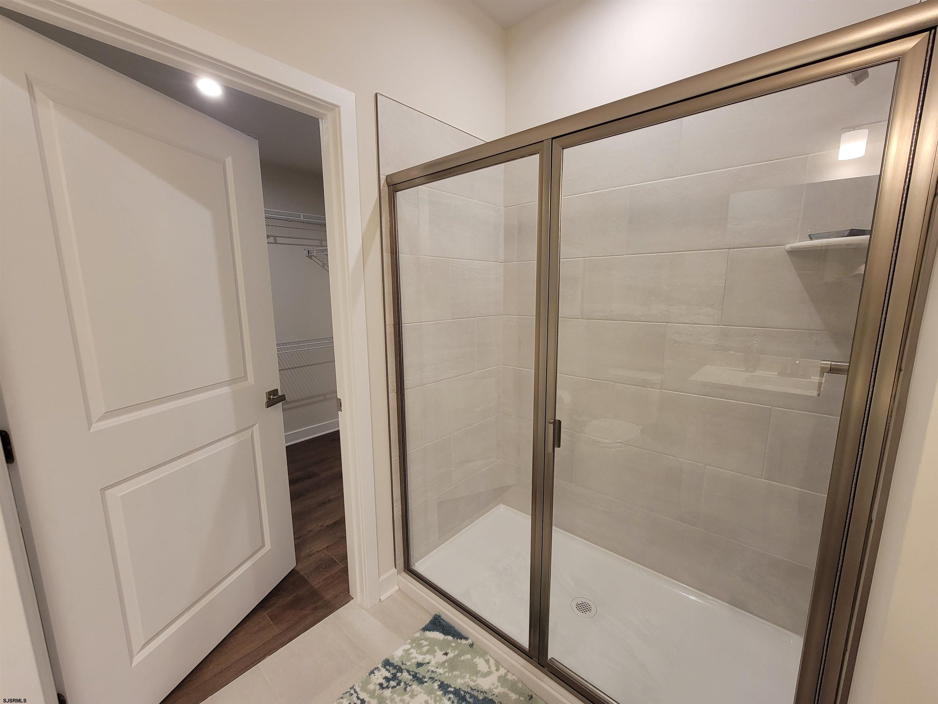 1004 Jesse Drive Somers Point, NJ 08244 - Photo 21 of 45 a bathroom with a glass shower door