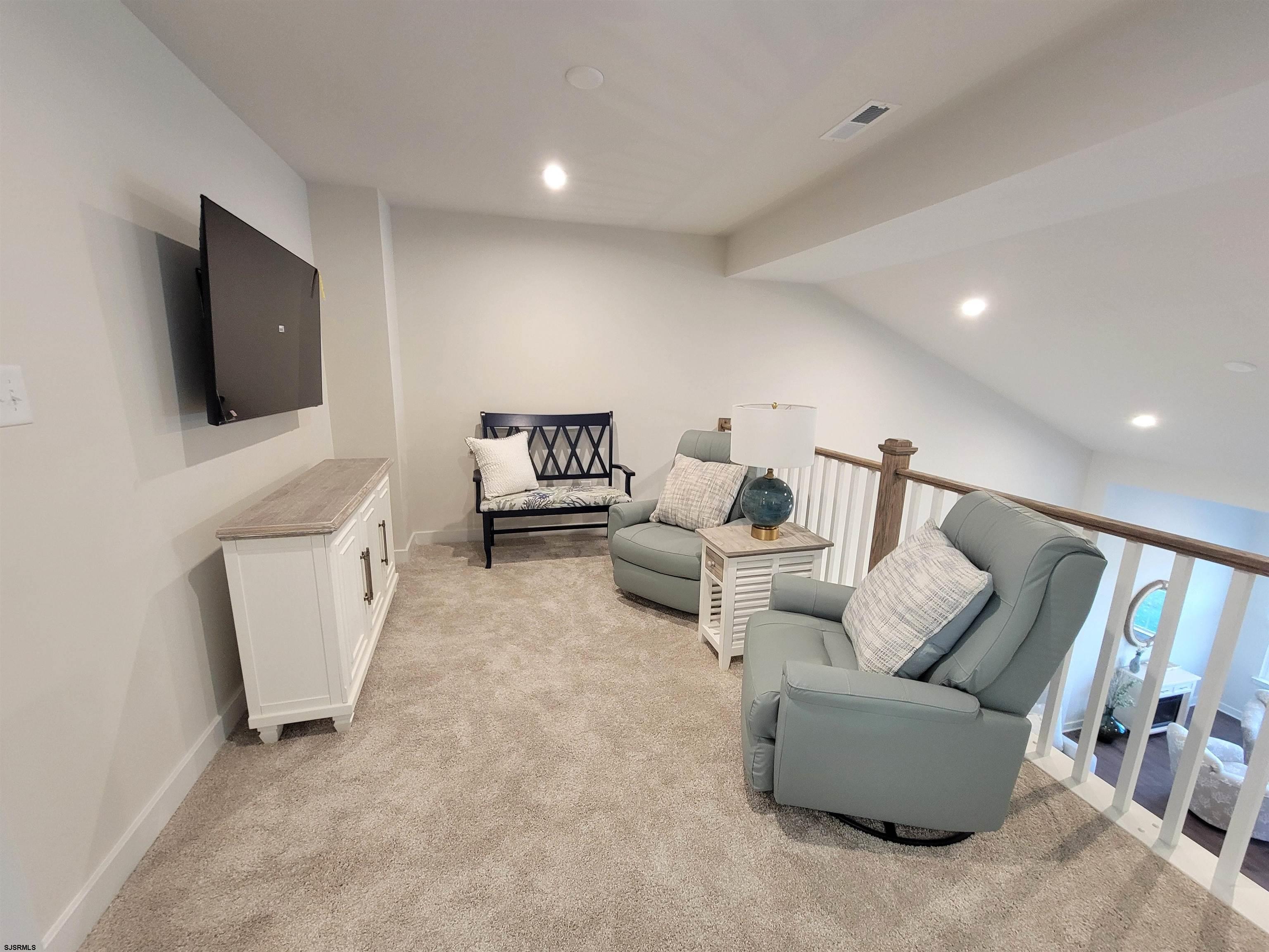 1004 Jesse Drive Somers Point, NJ 08244 - Photo 25 of 45 a living room with furniture and a flat screen tv