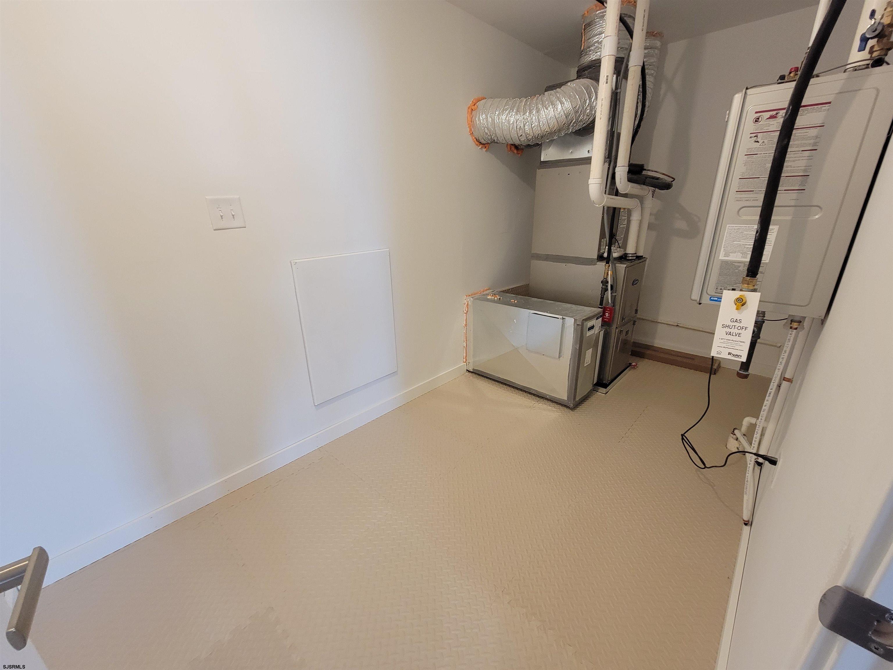 1004 Jesse Drive Somers Point, NJ 08244 - Photo 29 of 45 a room with water heater and car parked