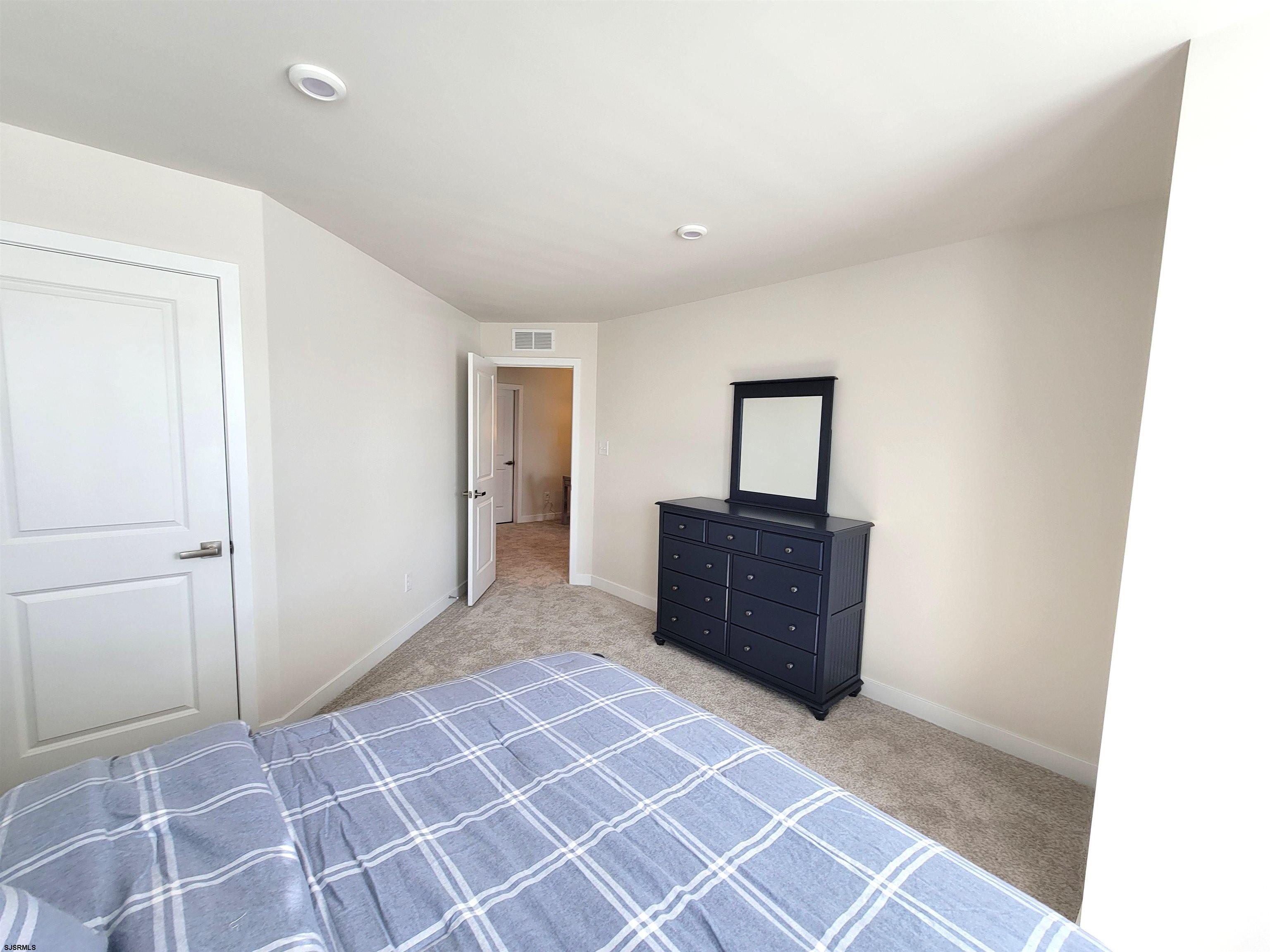 1004 Jesse Drive Somers Point, NJ 08244 - Photo 35 of 45 a room with a bed and a table