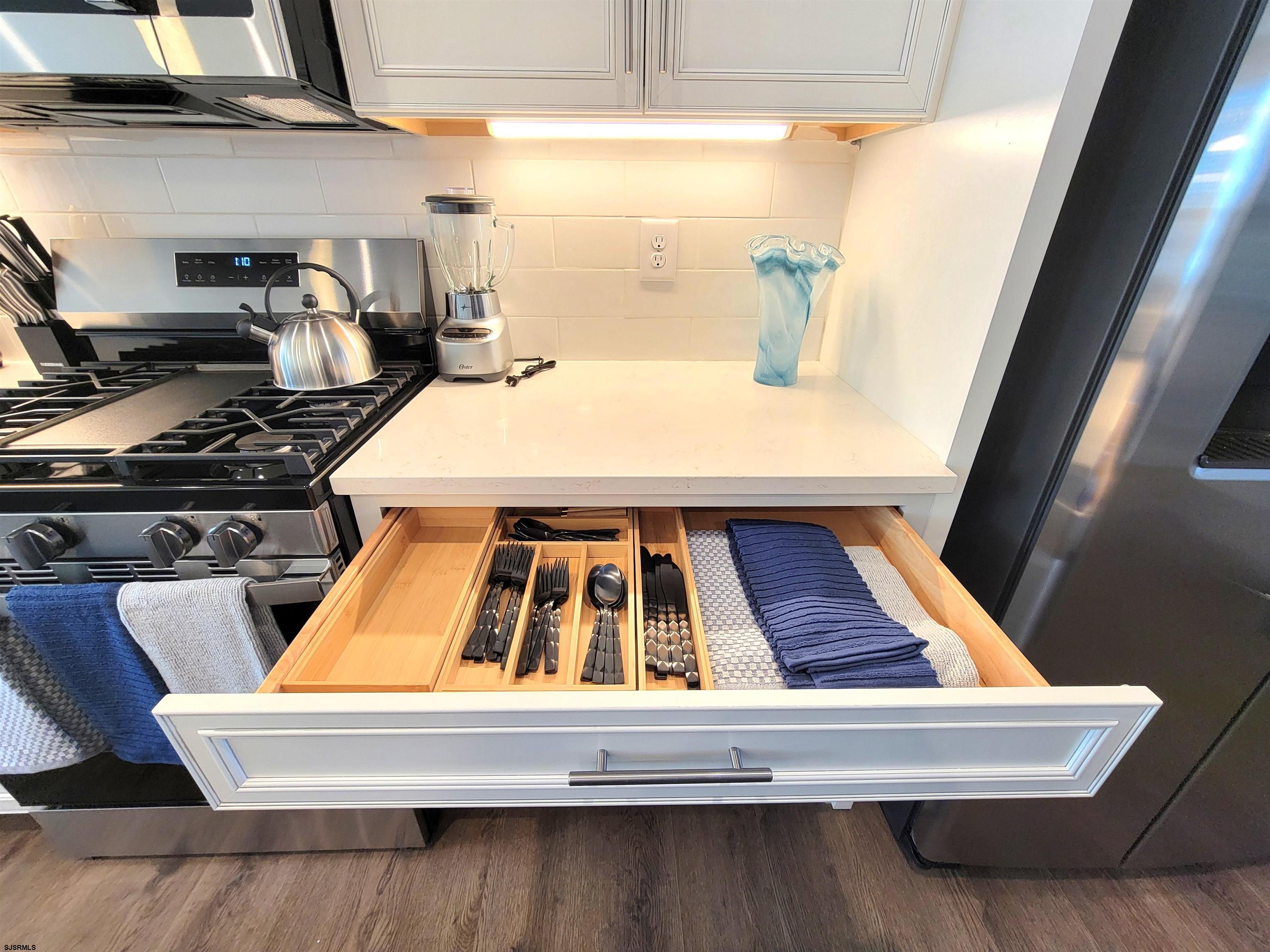 1004 Jesse Drive Somers Point, NJ 08244 - Photo 44 of 45 a bed sitting in a kitchen next to a window