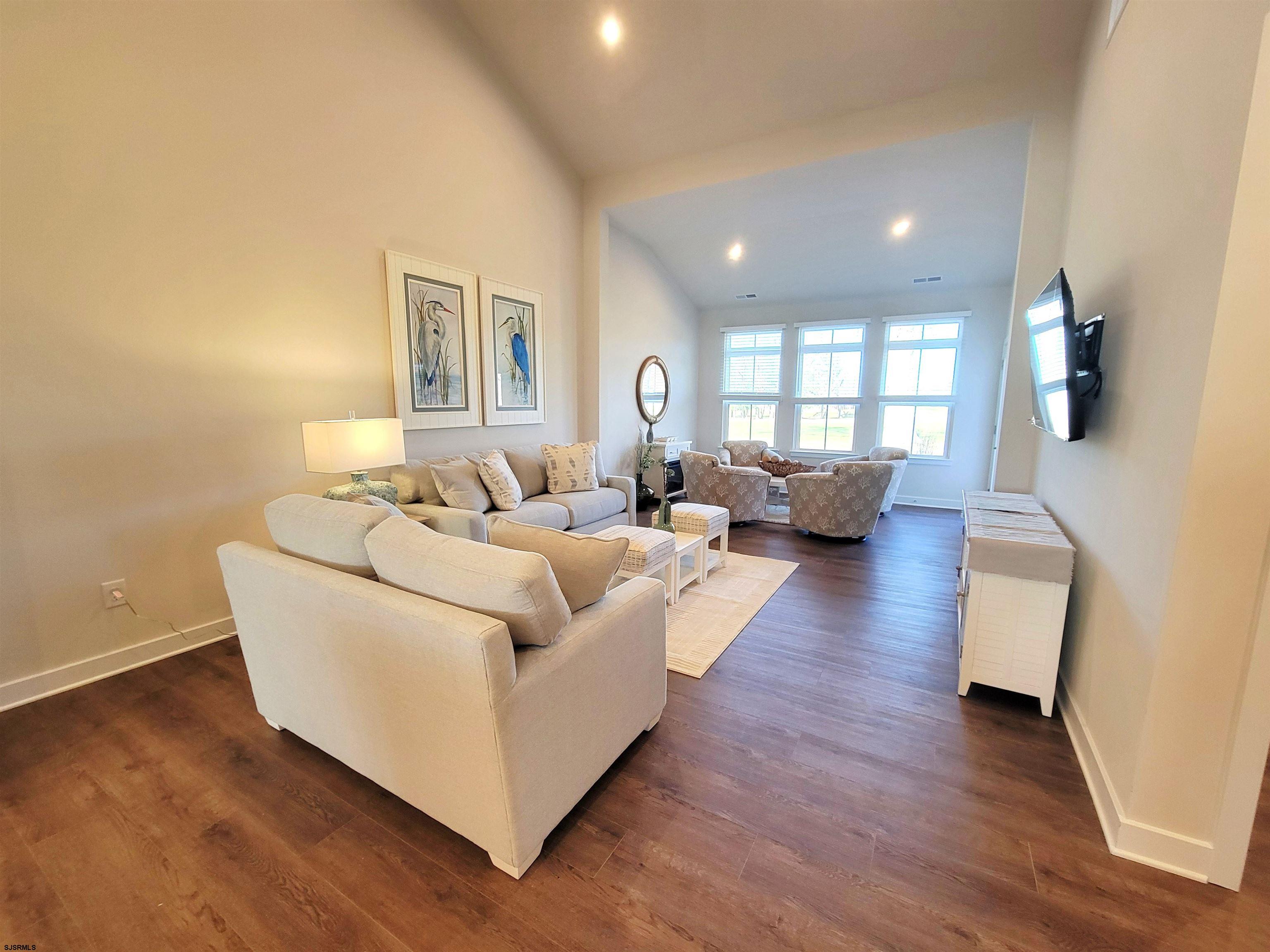 1004 Jesse Drive Somers Point, NJ 08244 - Photo 10 of 45 a living room with couches and a large mirror with wooden floor