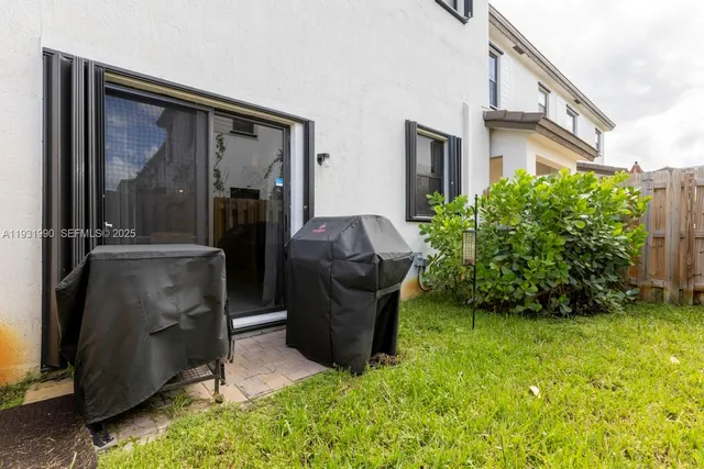 a backyard of a house with seating space