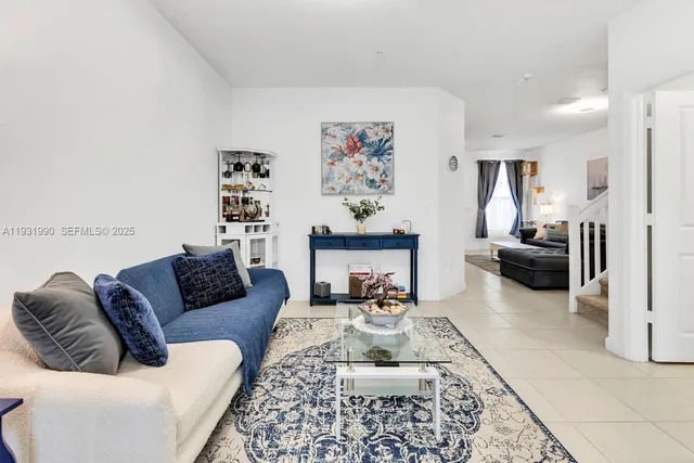 a living room with furniture and a couch