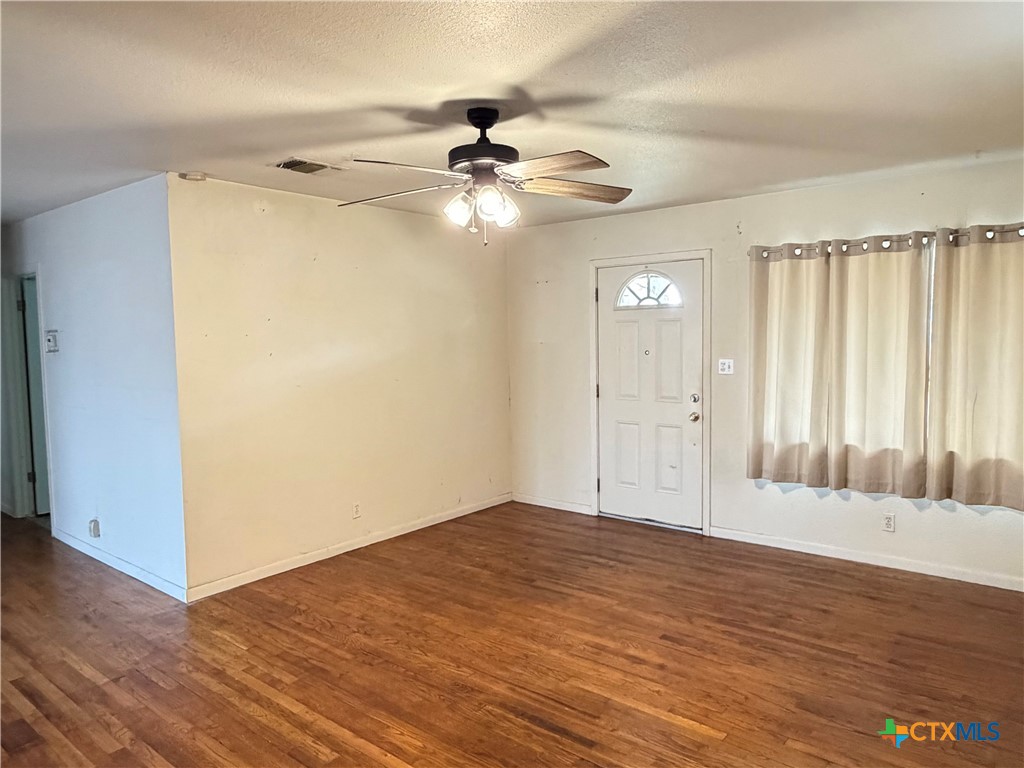 1902 Navidad Street Victoria, TX 77901 - Photo 8 of 23 a view of an empty room and wooden floor