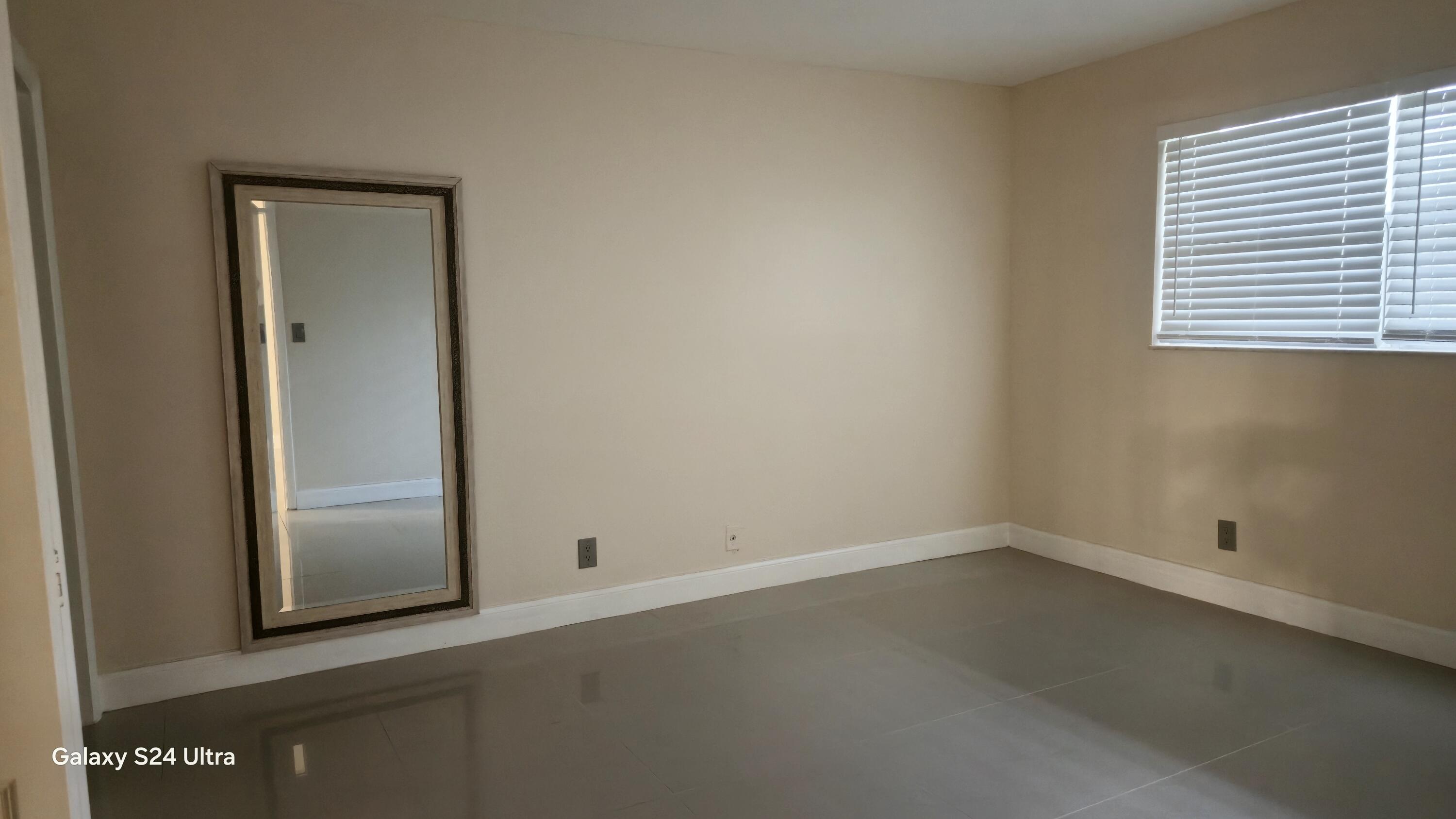8000 South Colony Circle, Unit 309 Tamarac, FL 33321 - Photo 7 of 16 an empty room with a window
