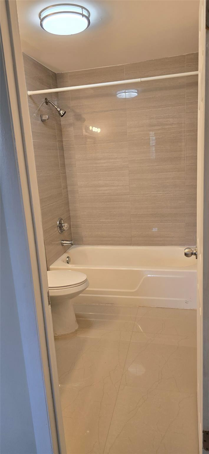 8000 South Colony Circle, Unit 309 Tamarac, FL 33321 - Photo 9 of 16 a bathroom with a shower and a sink