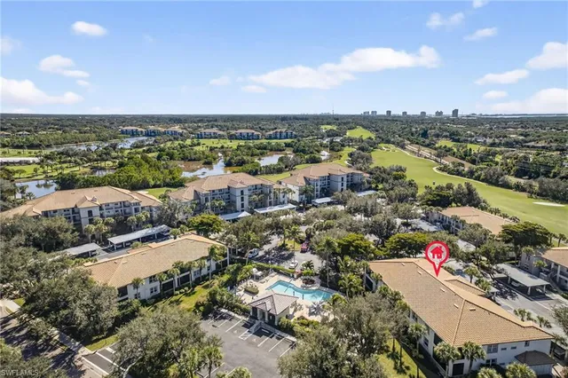 an aerial view of city and lake