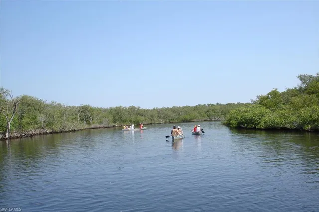 a view of a house with swimming pool and porch