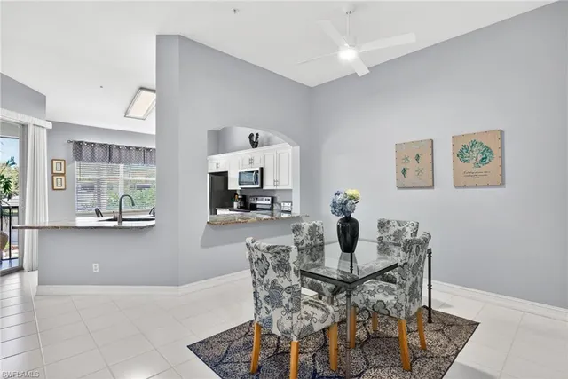 a dining room with furniture and window