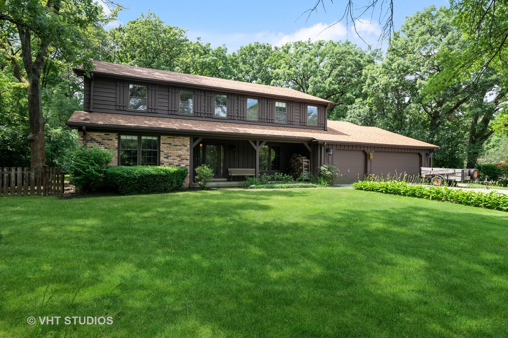 60 North Ridge Road Lake Forest, IL 60045 - Photo 2 of 36 a front view of a house with a garden