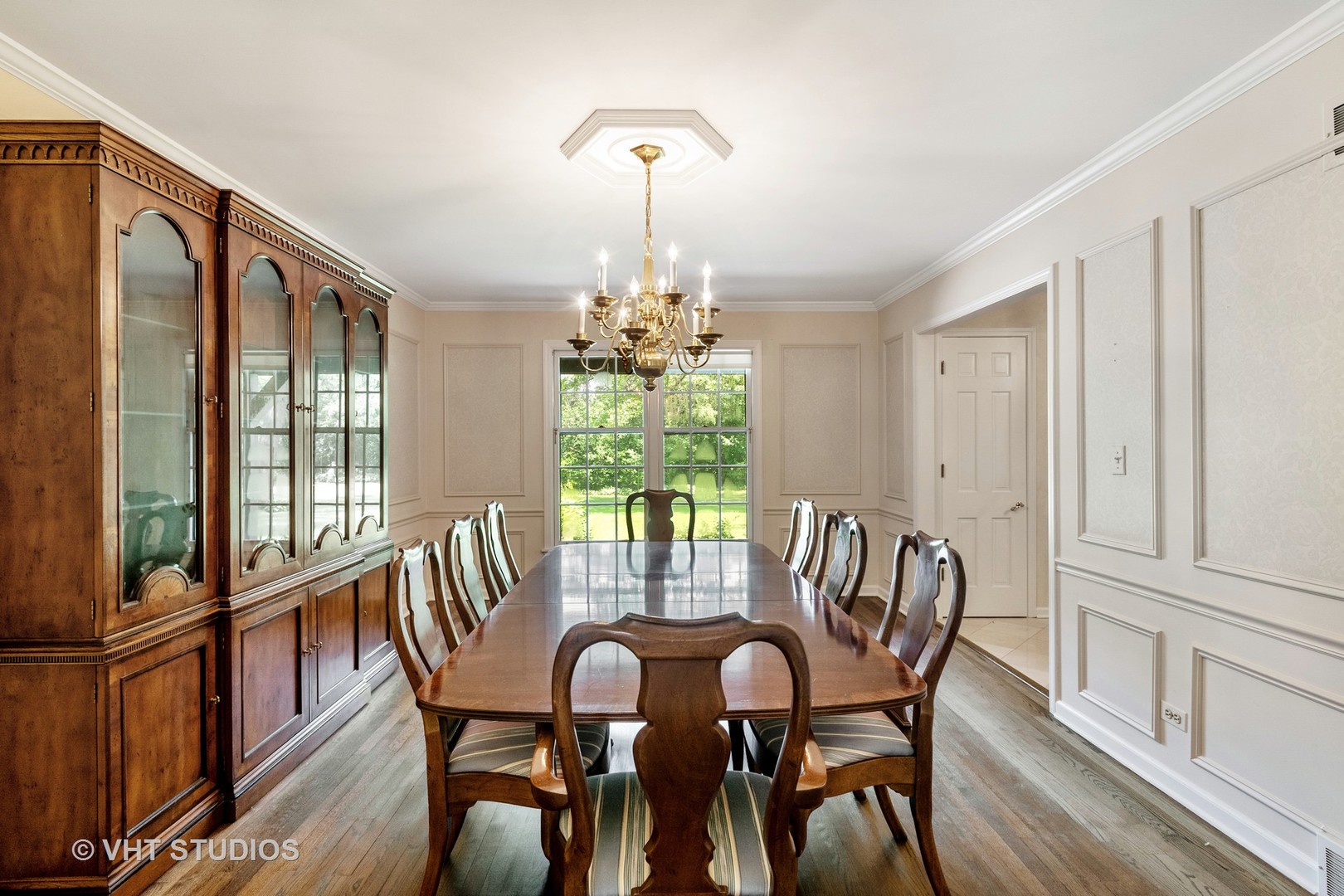 60 North Ridge Road Lake Forest, IL 60045 - Photo 12 of 36 a view of a dining room with furniture window and wooden floor