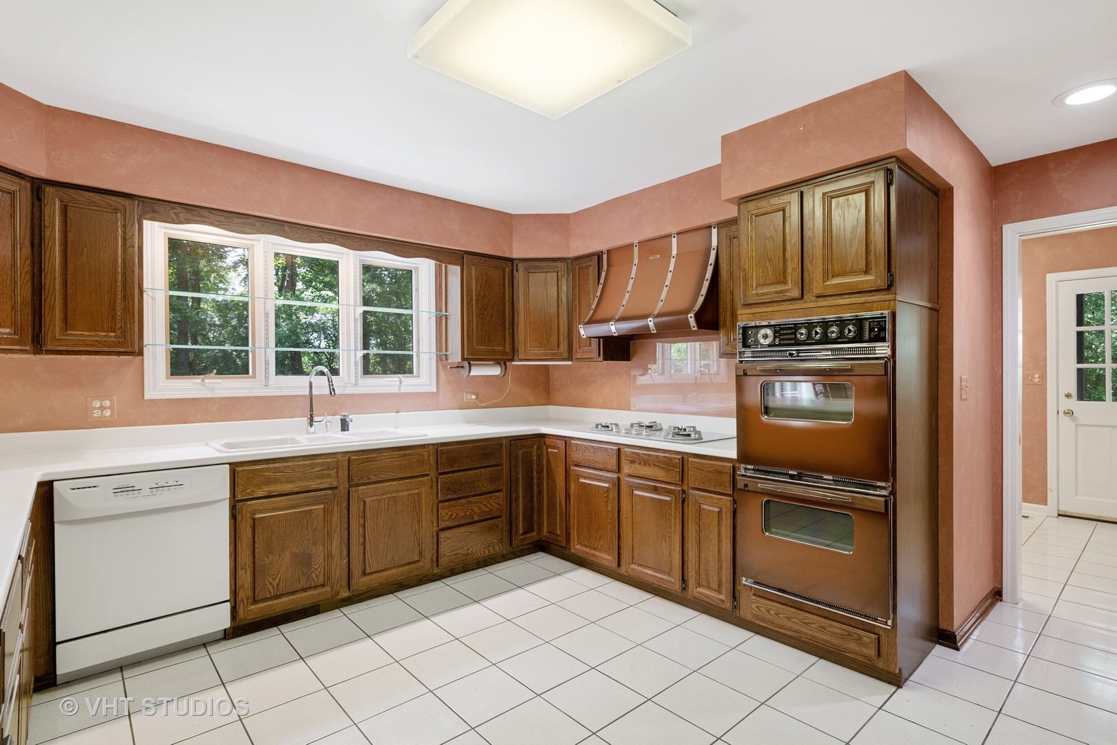 60 North Ridge Road Lake Forest, IL 60045 - Photo 16 of 36 a kitchen with stainless steel appliances granite countertop a stove sink and cabinets