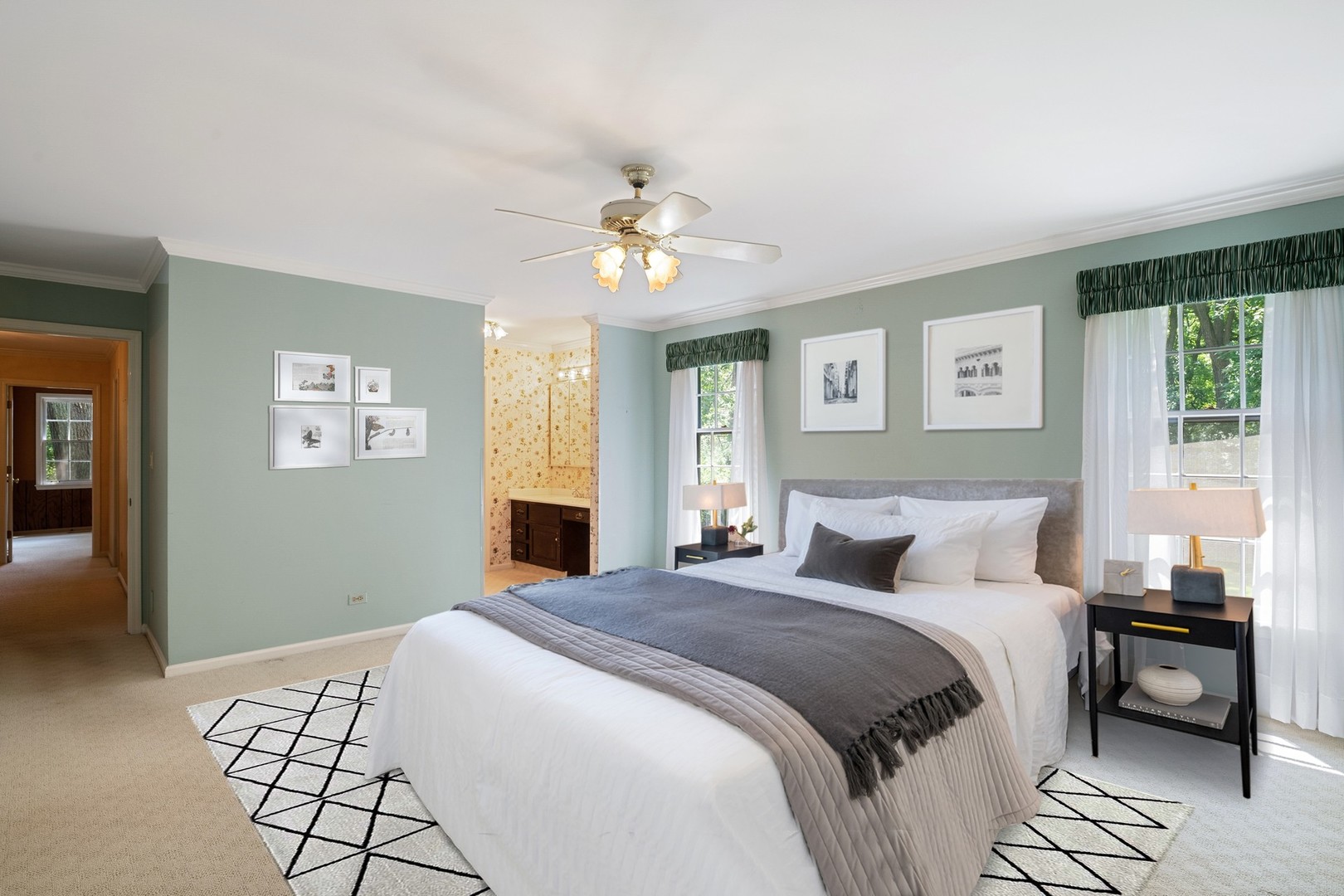 60 North Ridge Road Lake Forest, IL 60045 - Photo 18 of 36 a bedroom with a bed and a chandelier
