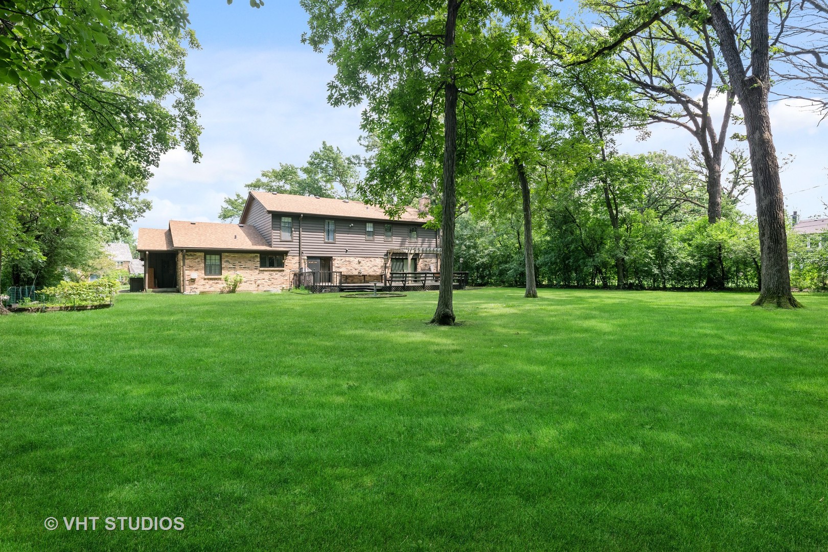 60 North Ridge Road Lake Forest, IL 60045 - Photo 27 of 36 a view of a house next to a big yard and large trees