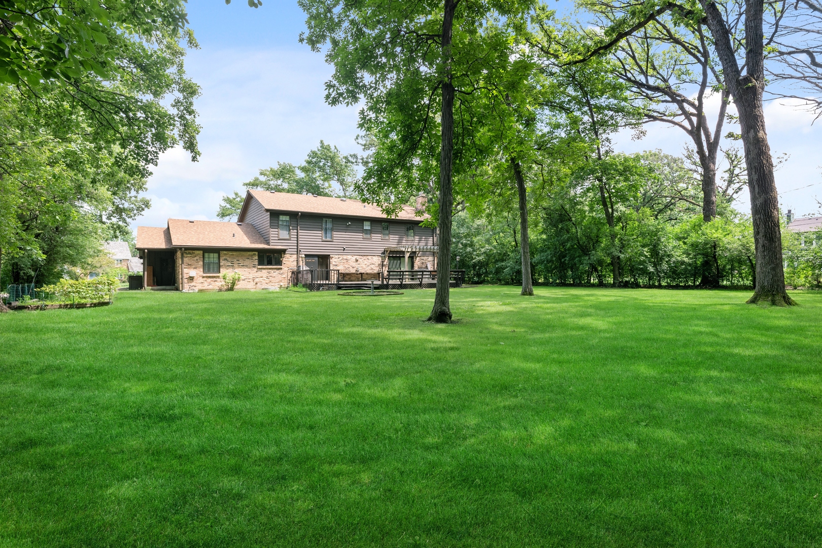 60 North Ridge Road Lake Forest, IL 60045 - Photo 35 of 36 a view of a house next to a big yard and large trees