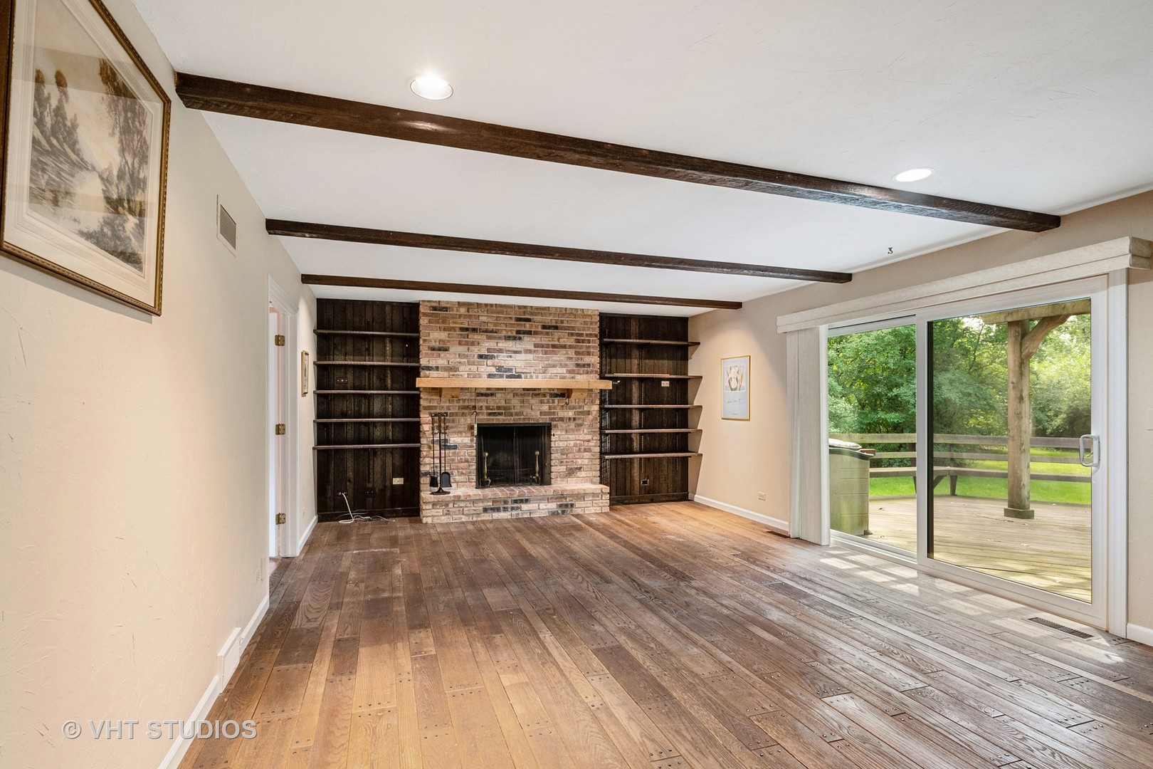 60 North Ridge Road Lake Forest, IL 60045 - Photo 9 of 36 a view of empty room with wooden floor and fireplace