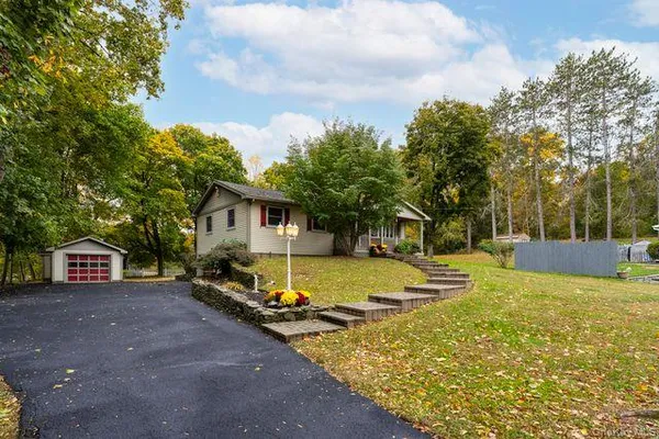 a view of a house with basketball court