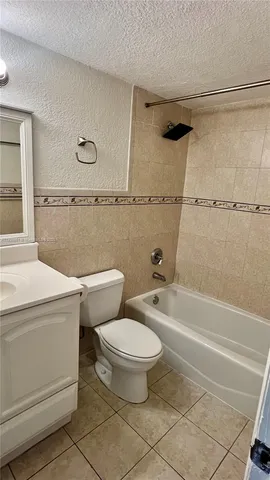 a bathroom with a toilet a sink and a shower