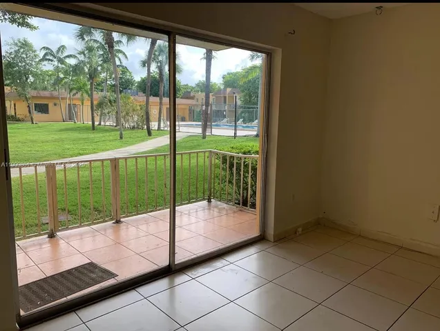 a view of a porch and garden