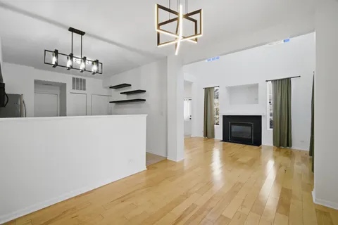 a kitchen with kitchen island a sink and a stove