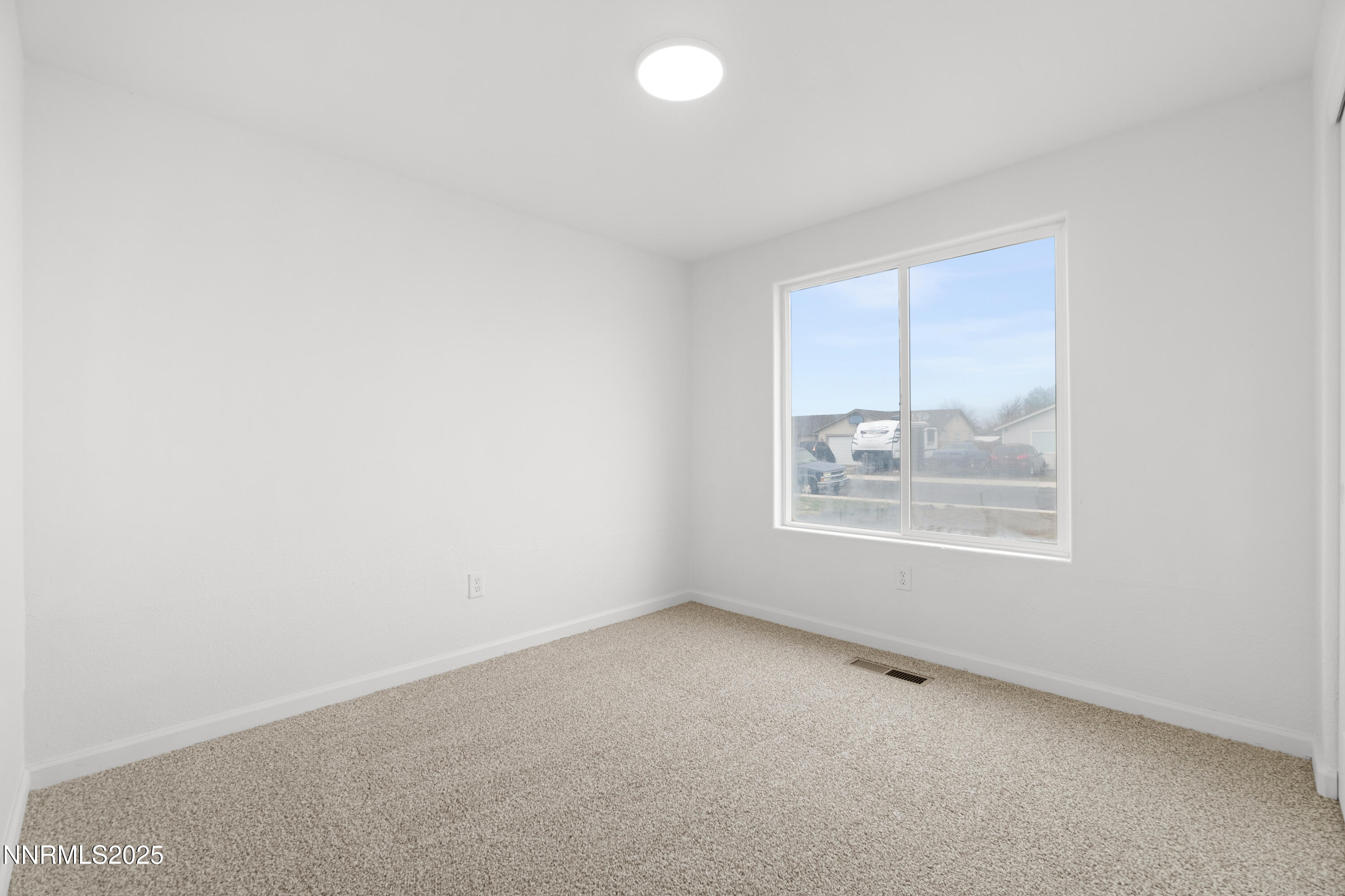 123 Shadow Mountain Drive Fernley, NV 89408 - Photo 16 of 28 an empty room with a window