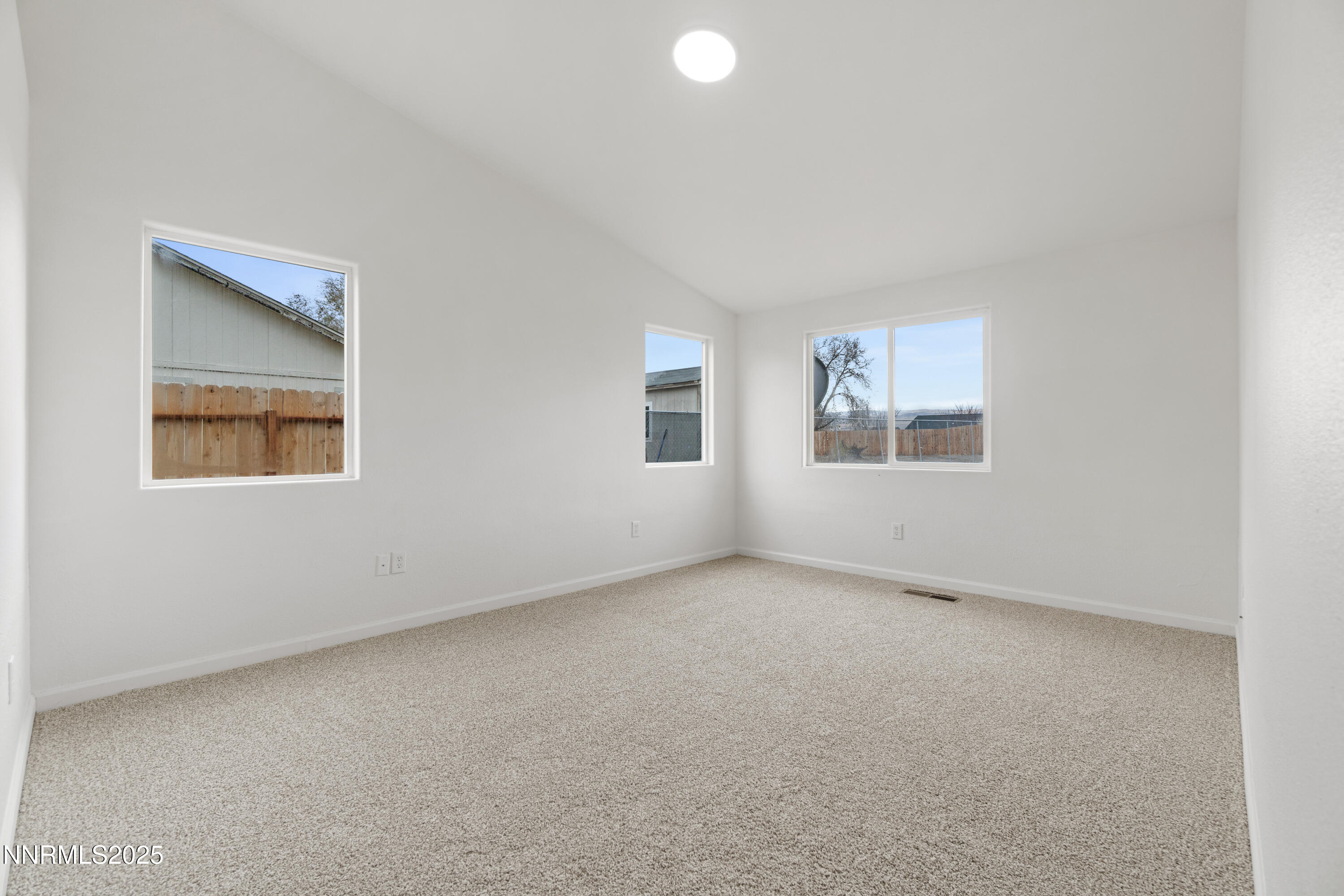 123 Shadow Mountain Drive Fernley, NV 89408 - Photo 21 of 28 an empty room with windows