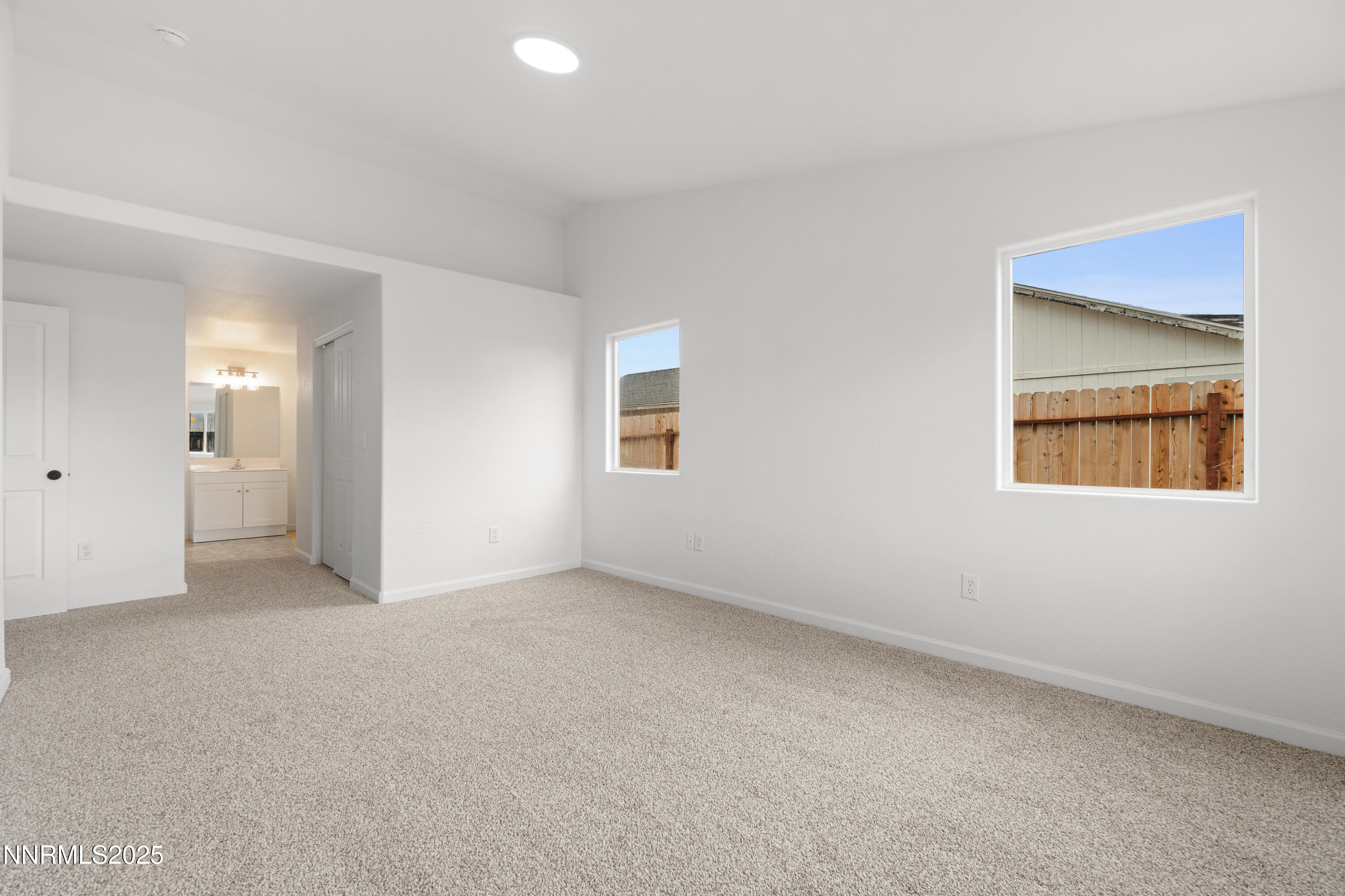 123 Shadow Mountain Drive Fernley, NV 89408 - Photo 22 of 28 an empty room with windows