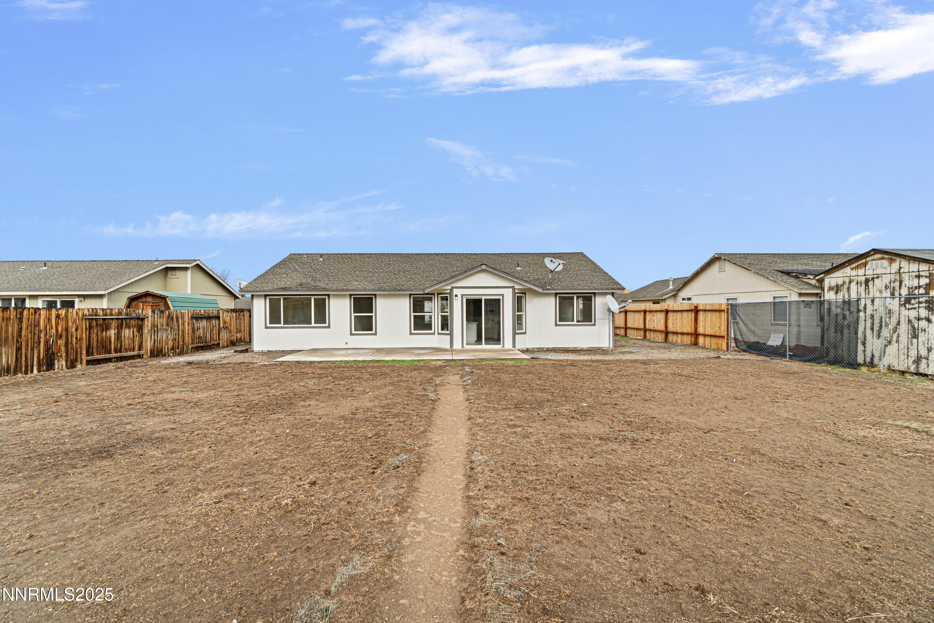 123 Shadow Mountain Drive Fernley, NV 89408 - Photo 26 of 28 a front view of house with yard and car parked