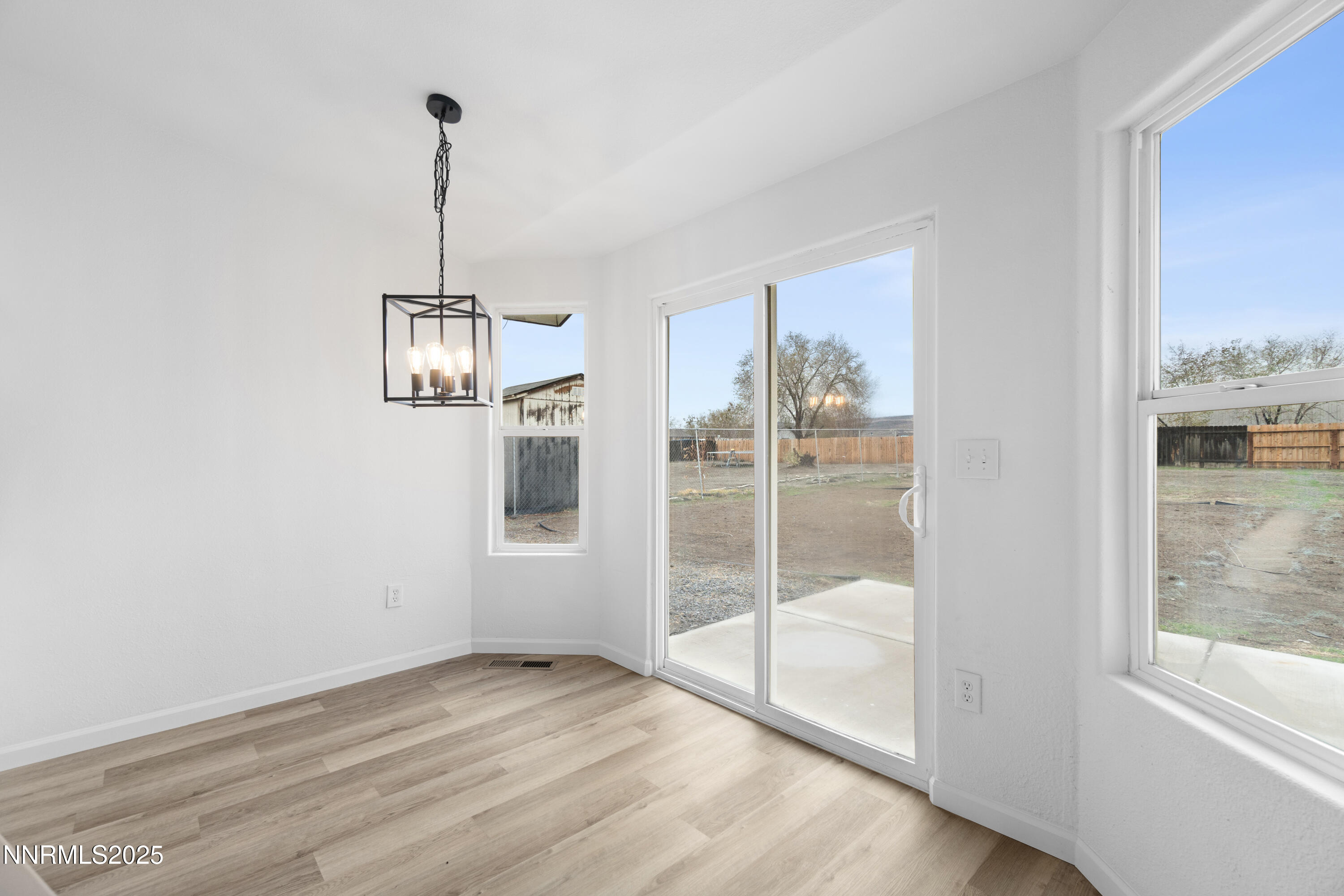123 Shadow Mountain Drive Fernley, NV 89408 - Photo 10 of 28 a view of empty room with windows