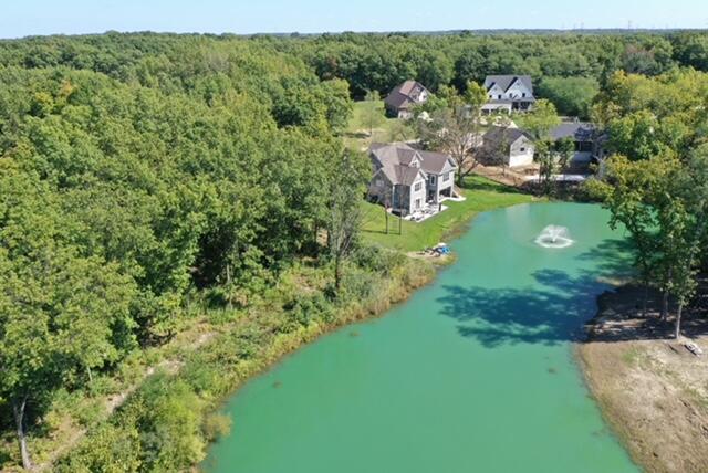 a view of a garden with a building in the background