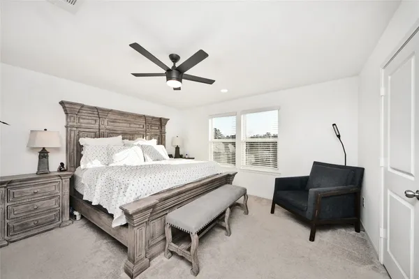 a bed room with a bed and a couch