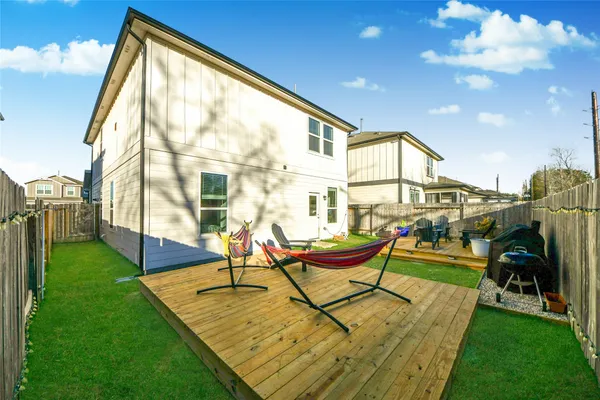 a house view with swimming pool and sitting space