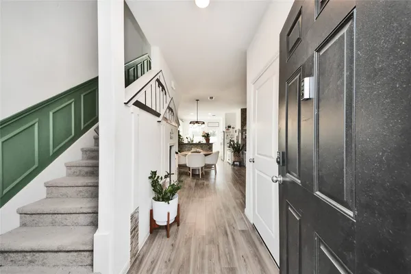 a view of a living room and entryway