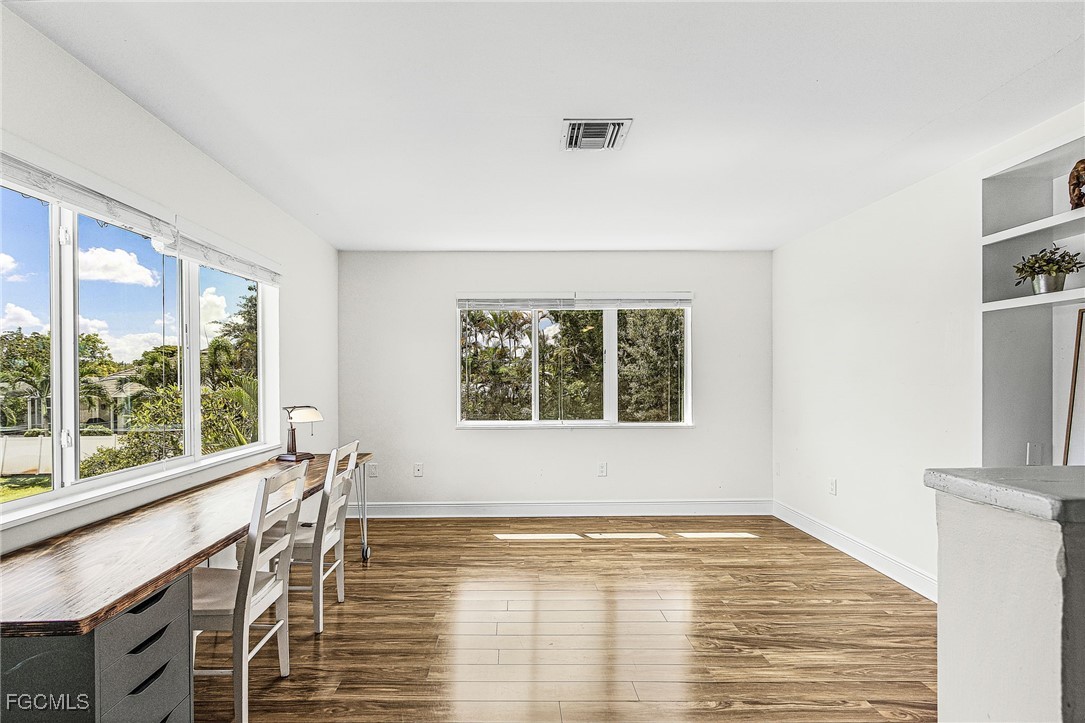 1060 Cooper Drive Naples, FL 34103 - Photo 16 of 33 a view of an empty room with a window