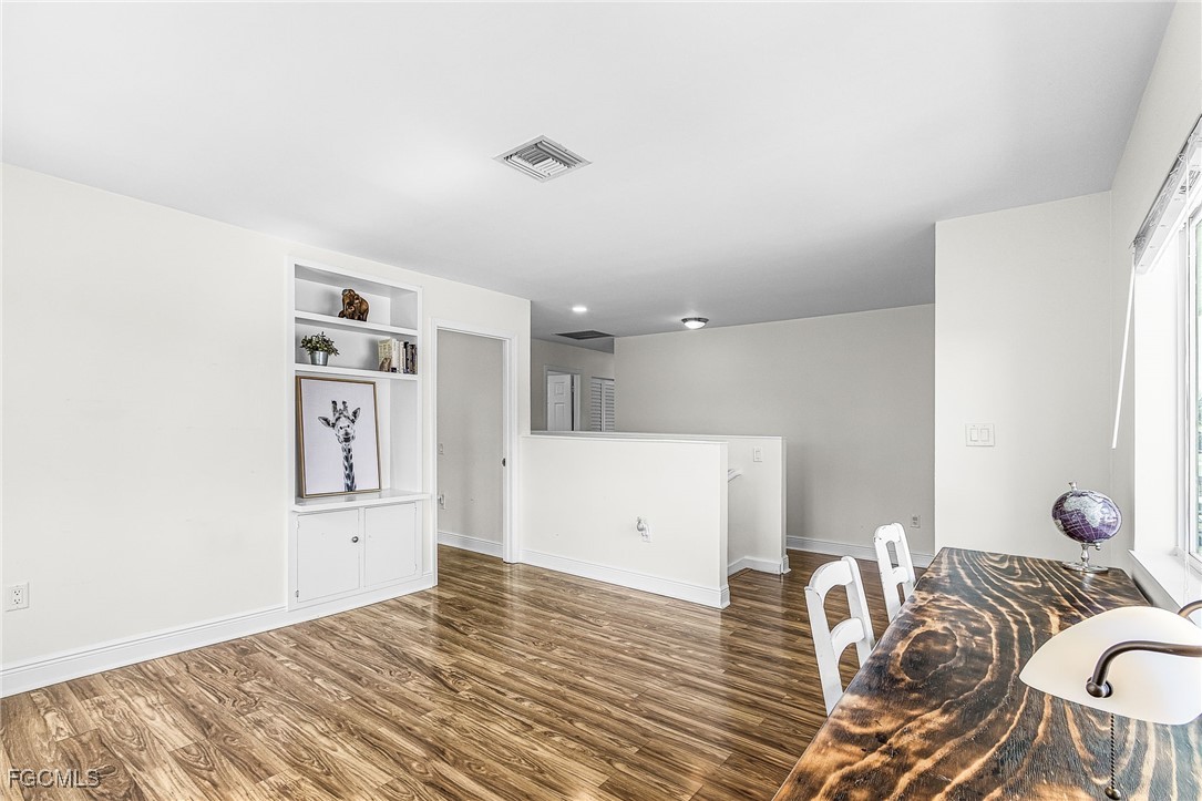 1060 Cooper Drive Naples, FL 34103 - Photo 17 of 33 a view of a livingroom with furniture and wooden floor